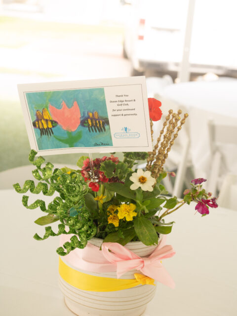 Centerpiece of flowers on a table.